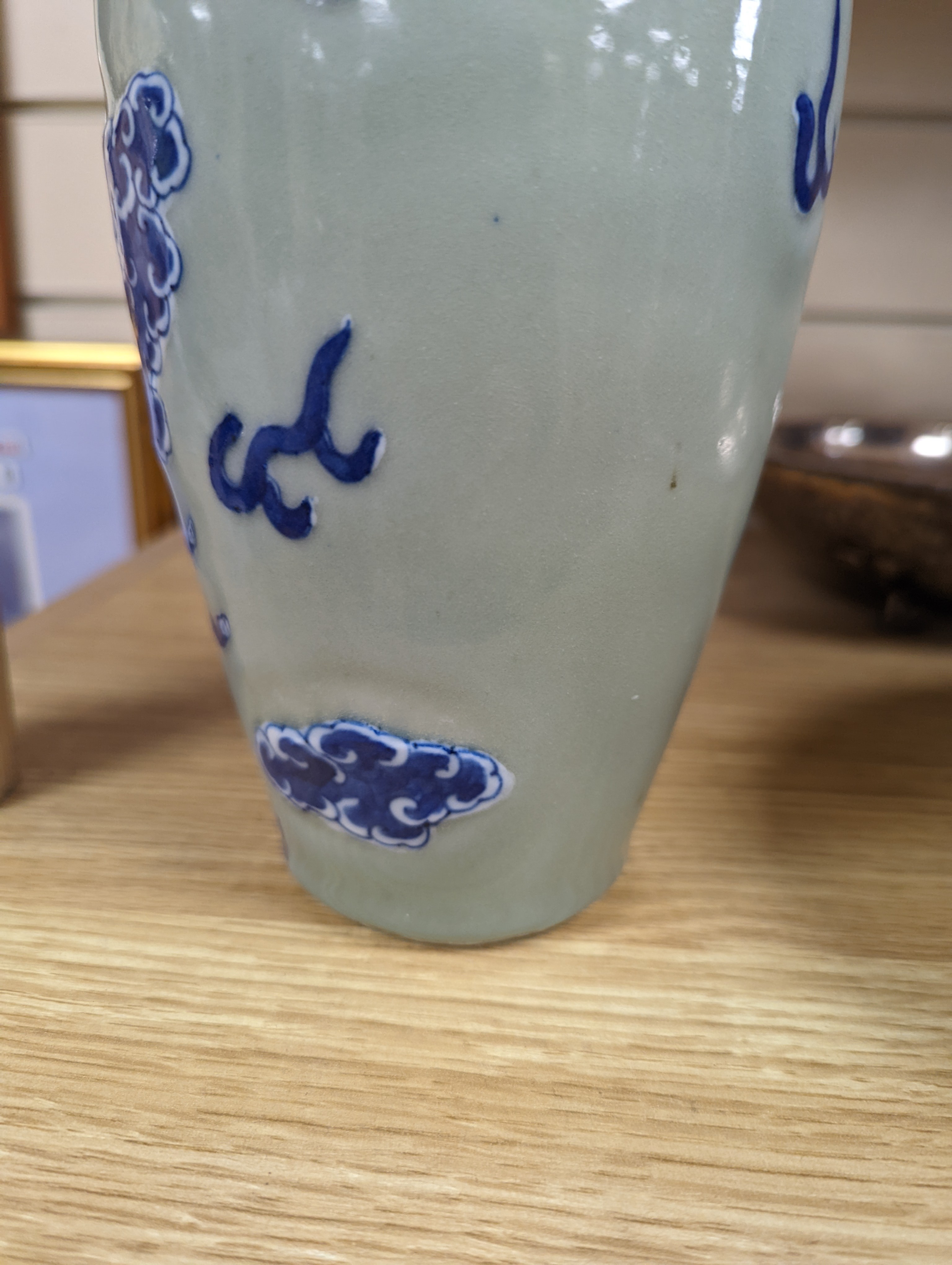A Chinese celadon glazed vase, 24cm and a Chinese famille rose teapot and matching cream jug, a.f.